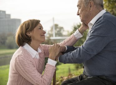 Senior man with daughter outdoors